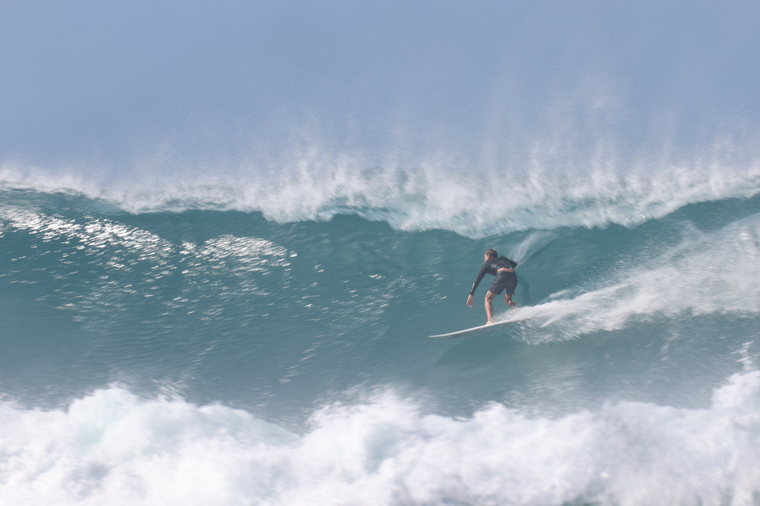 Angel Alvarez riding the tube of a huge wave at Tres Palmas Marine Reserve. 